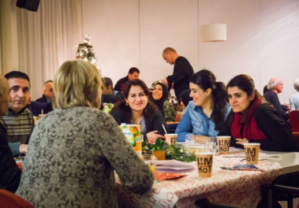 Kerken aan tafel met vluchtelingen
